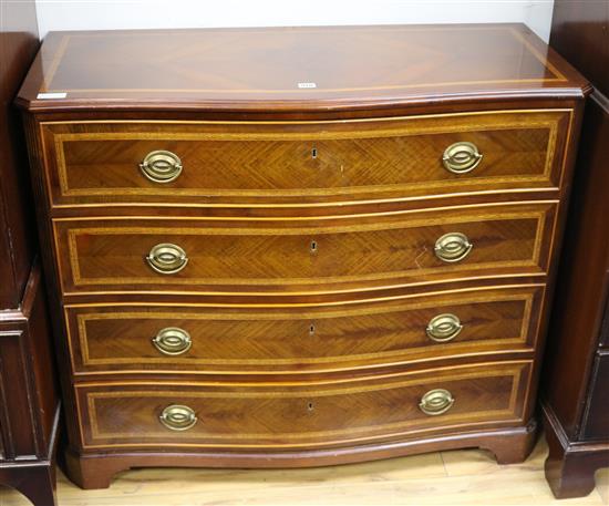 A mahogany serpentine inlaid chest of drawers W.110cm